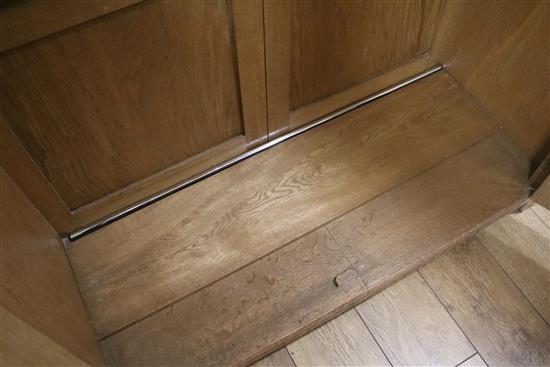 A five piece carved oak bedroom suite